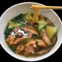 Duck Noodle Soup · Yellow egg noodles, baby bok choy, scallions, shitake mushrooms and herb marinated duck in a...