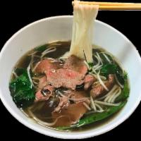 Pho Noodle Soup · Traditional Vietnamese noodle soup with choice of beef or chicken.