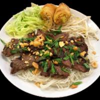 Saigon Street Noodles Beef · Marinated grilled beef with lemon grass sauce, lettuce, bean sprouts, spring roll, roasted p...