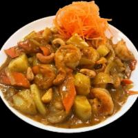 Massaman Curry · A sweet aromatic brown curry with potatoes, onions, carrots and cashew nuts. Served with cho...