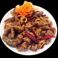 Orange Beef · Stir-fried in a sweet and sour orange sauce with scallions and dried chillies. Served with c...