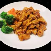 Spicy Chicken · Crispy chicken sauteed with a sweet chili sauce, garlic, carrots and broccoli. Served with c...