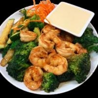 Hibachi Shrimp · Grilled with broccoli and zucchini in hibachi sauce. Served with choice of rice and either s...