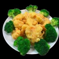Honey Shrimp · Lightly deep fried shrimp sauteed in chef's special mayonnaise sauce,
layed over a bed of br...