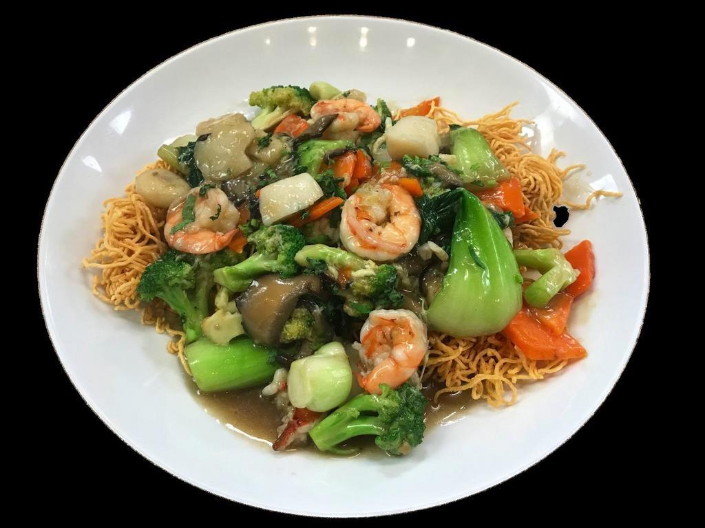Vietnamese Crispy Noodles · Shrimp, scallops, lobster meat, shitake mushrooms, broccoli, bok choy, carrots and water chestnuts in chef's special sauce served over a bed of crispy egg noodles. Served with choice of rice and either side.