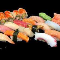 Sushi Deluxe Combo · 13 pieces of assorted nigiri and a shrimp tempura roll. Served with house salad and miso soup.