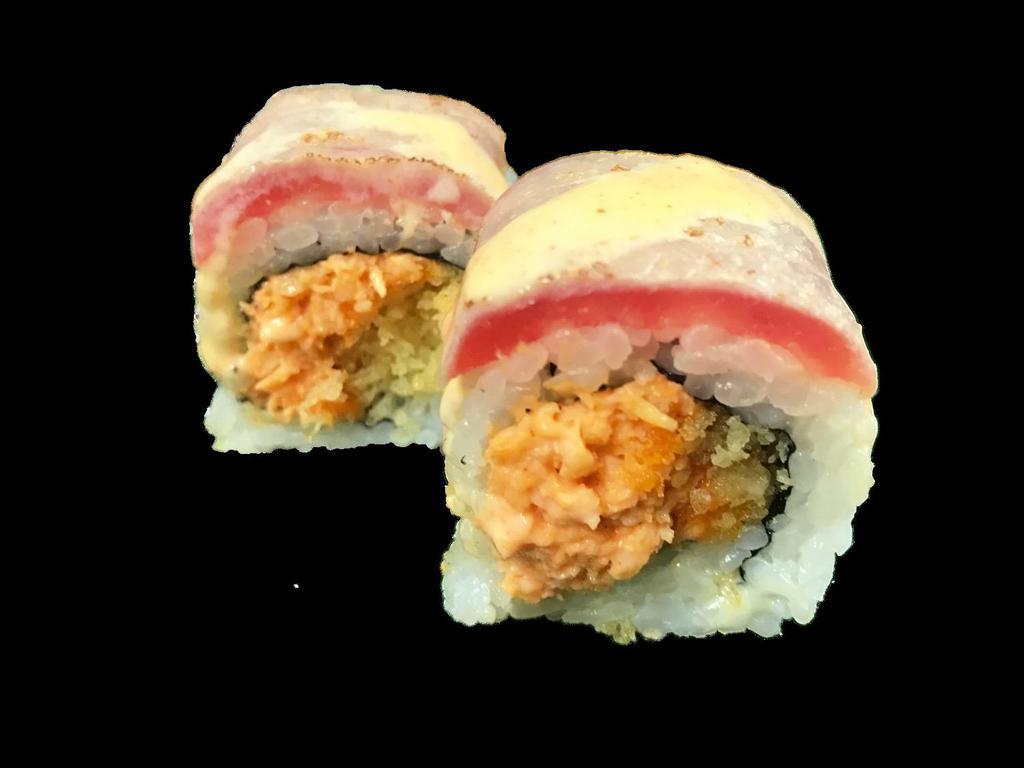 Maguro Tartar Roll · Spicy scallop and tempura flakes inside topped with seared tuna and spicy mayo.