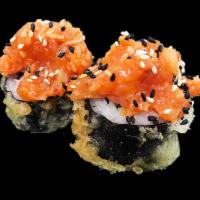 Poseidon Roll · Crab stick, ebi shrimp and asparagus prepared tempura style topped with a spicy seafood mix.