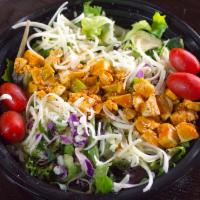 Buffalo Chicken Salad · House salad blend, grilled chicken breast, Buffalo sauce, shredded white cheddar, and tortil...