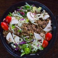 Steak Salad · House salad blend, grilled steak, mushrooms, shredded white cheddar, and tortilla strips wit...