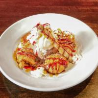 Fried Oreo Cookies · Vanilla and strawberry ice cream with caramel and chocolate sauce.