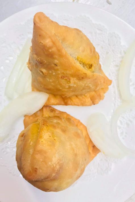1. Chicken Samosa · Crispy pastry turnover filled with ground chicken.