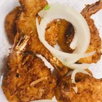 5. Shrimp Pakora · Deep fried shrimp served with onion ring.