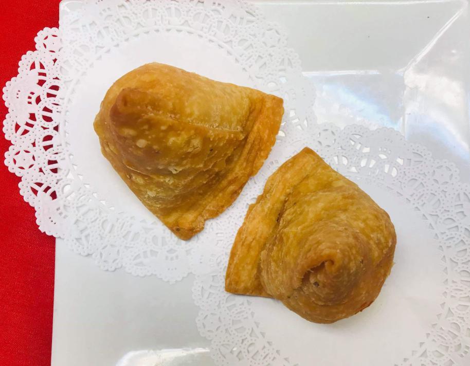 14. Vegetable Samosa · Crispy pastry turnover filled with mixed vegetables and potato.