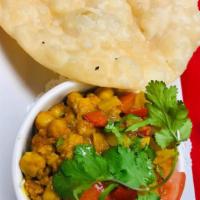 18. Chana Poori · Chickpeas cooked with onion and served with poori bread.