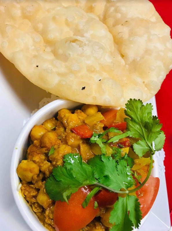 18. Chana Poori · Chickpeas cooked with onion and served with poori bread.