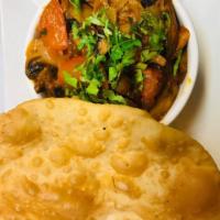 19. Garlic Mushroom Bhaji · Fresh mushroom cooked with garlic tomatoes and onion served with poori bread.