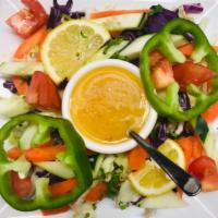 34. Fresh Garden Salad · Fine garden fresh tomatoes, lettuce, cucumber, green pepper and carrots mixed with salad dre...