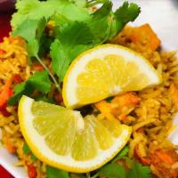 143. Chicken Tikka Biryani · Marinated in ginger, garlic and yogurt cooked with basmati rice, almond and raisin.