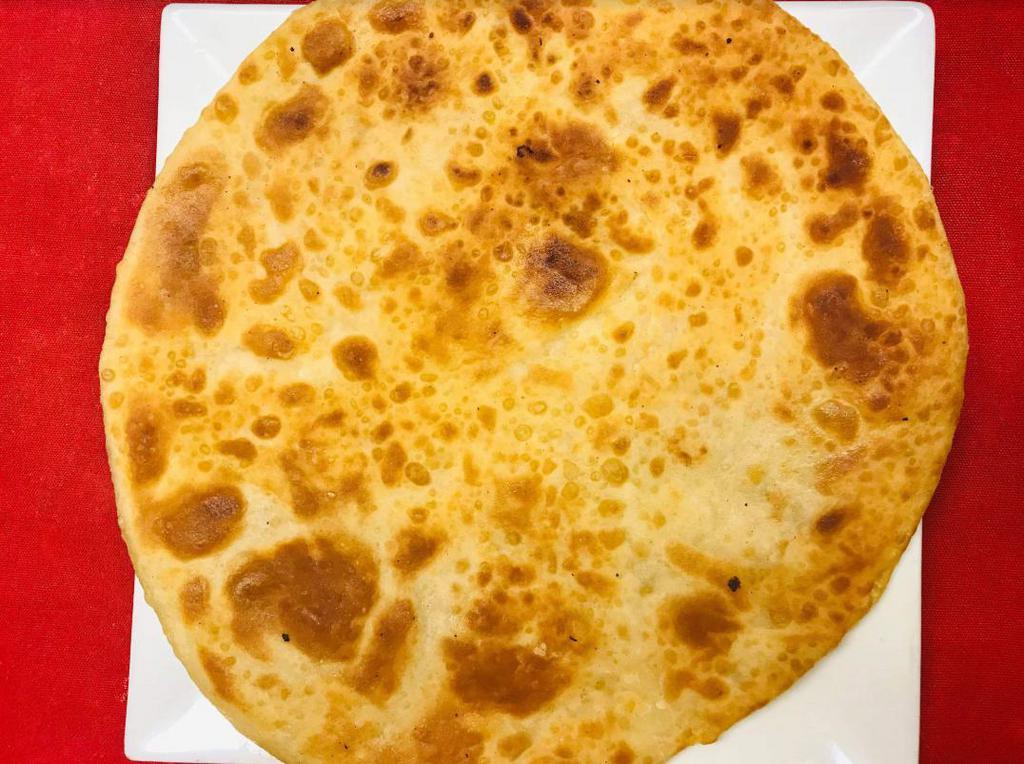 42. Paratha · Whole wheat layered flour buttered soft bread. Freshly baked bread from tandoori clay oven.