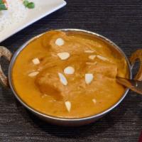 60. Korma (Mild) · Cooked with saffron creamy almond sauce and pineapple.