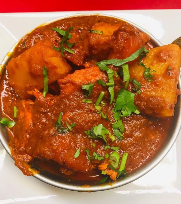 64. Madras (Fairly Hot) · Cooked with tomato and medium curry sauce.