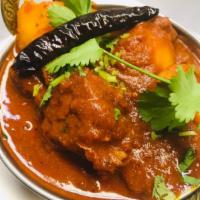 65. Vindaloo (Very Hot) · Cooked with vinegar, hot chilies and spices.