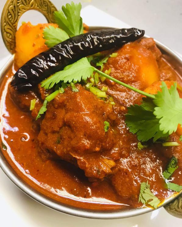 65. Vindaloo (Very Hot) · Cooked with vinegar, hot chilies and spices.