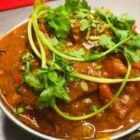 67. Rogan Josh · Cooked with house blended cadamon sauce.
