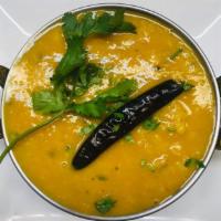 80. Yellow Tarka Dal · Yellow lentils cooked with spices, onions and tomatoes. Served with basmati rice.