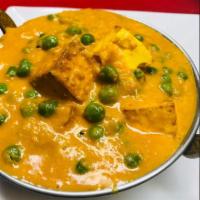 96. Matar Panir · Indian cheese with peas and sauce. Served with basmati rice.