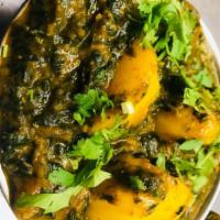 101. Aloo Saag · Potato cooked fresh spinach. Served with basmati rice.