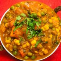 102. Daal Samber · Yellow lentils with mixed vegetables. Served with basmati rice.