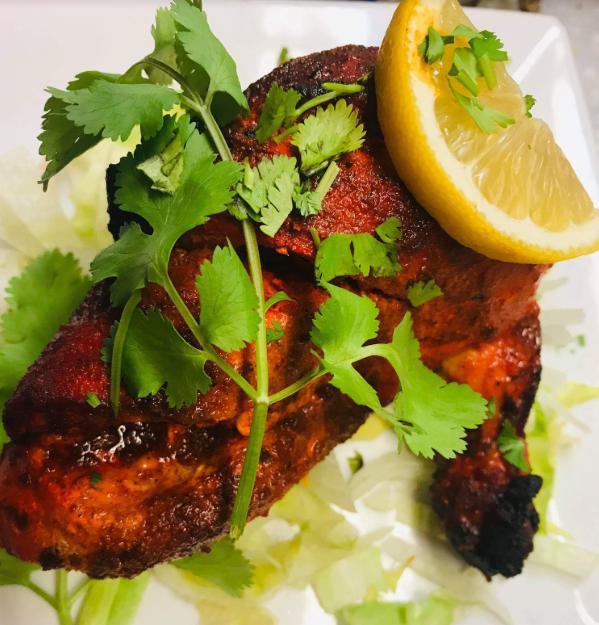 107. Tandoori Chicken · Chicken marinated in yogurt and spices, roasted in clay oven. Served with basmati rice.