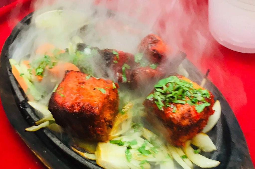 115. Salmon Fish Tandoori · Marinated in yogurt and spices roasted in clay oven. Served with basmati rice.