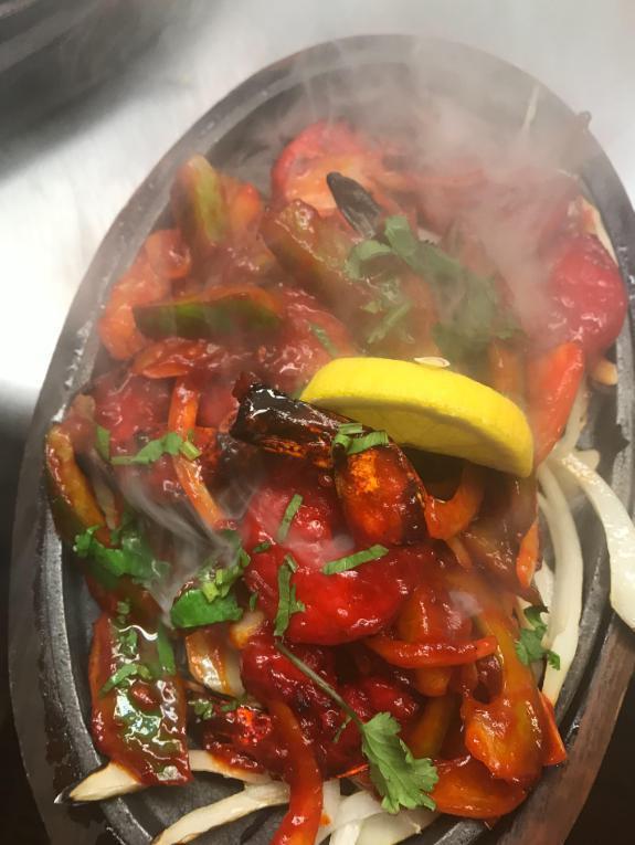 117. Tandoori Shrimp · Big size marinated shrimp cooked in clay oven, served with fresh spinach. Served with basmati rice.