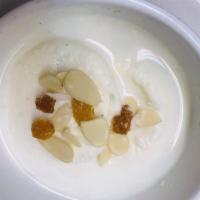 164. Rasmalai · Soft patties of homemade cheese poached in condensed milk sauce.