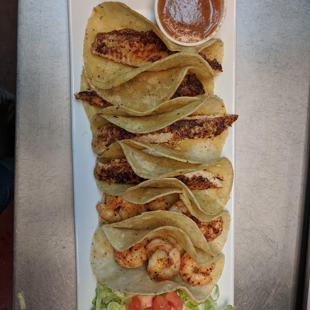  Four Fish Tacos Plate · Cheese, lettuce, tomato, Chipotle sauce