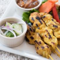 Chicken Satay · Grilled marinated chicken, Served with special peanut sauce and sweet cucumber sauce on the ...