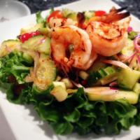 Thai Spicy Salad · Cucumber, tomato, onions and fresh chili in lemon juice, tossed with a choice of beef or shr...