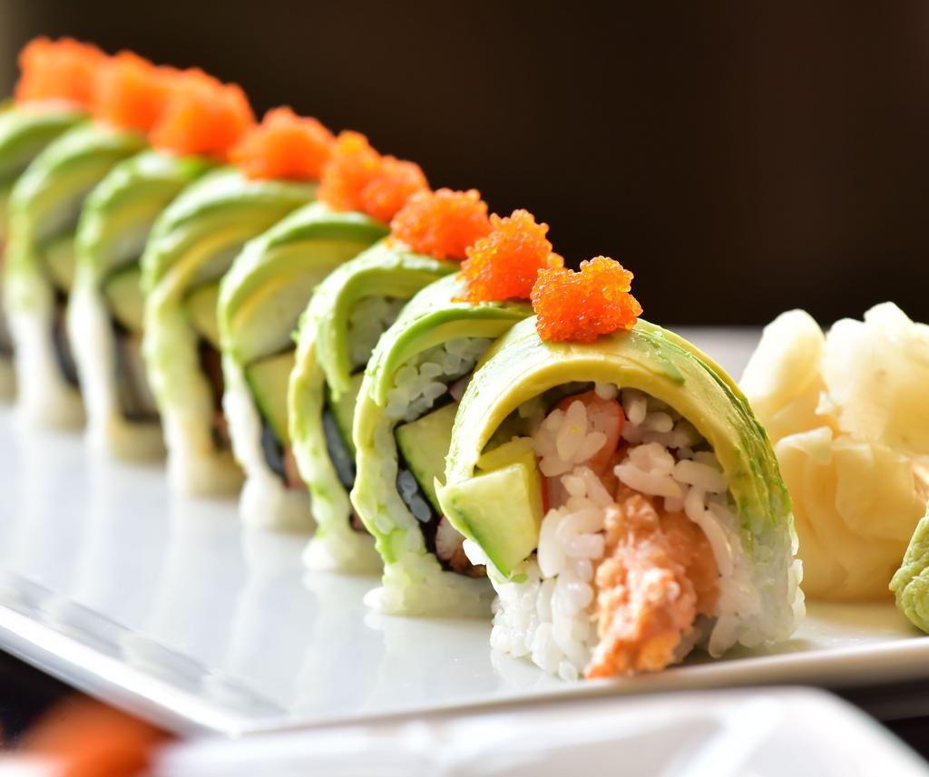 Dragon Roll · Shrimp tempura, crabstick and cucumber inside. Avocado and masago on the outside. 