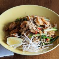 Lunch Pad Thai Noodle · Stir fried classic Thai rice noodle with egg, bean curd, peanuts and bean sprouts.  