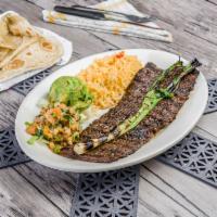 Asada Steak · Grilled fajita steak. Served with rice or beans, lettuce, guacamole, pico de gallo, and choi...