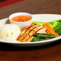 Salmon a la Ranchera #1 · Grilled salmon with fresh ranchero sauce on top, served with sauteed mixed vegetables, white...