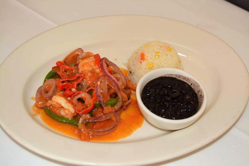 Camarones Yucatecos · Shrimp stew with fresh tomato sauce, red onions, bell peppers, fresh Habanero pepper, olive oil, black beans, and white rice.