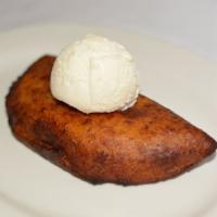 Empanadas de Platano con Helado de Vainilla · Fried plantain pie with Spanish cream inside  and vanilla ice cream on the side. 