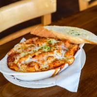Baked Rigatoni · Handmade rigatoni or gluten-free penne tossed with 3 toppings and sauce of your choice and c...