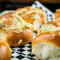 Garlic Knots · Homemade garlic knots covered with our own garlic spread. Get them individually or get 7 of ...