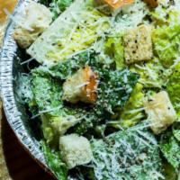 Caesar Salad · Romaine, homemade garlic croutons, Romano, and a homemade Caesar dressing.