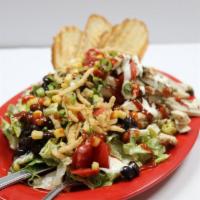 BBQ Chicken Salad · Romaine lettuce, ranch dressing, black beans, corn, green onion, fried onion, tomatoes and c...